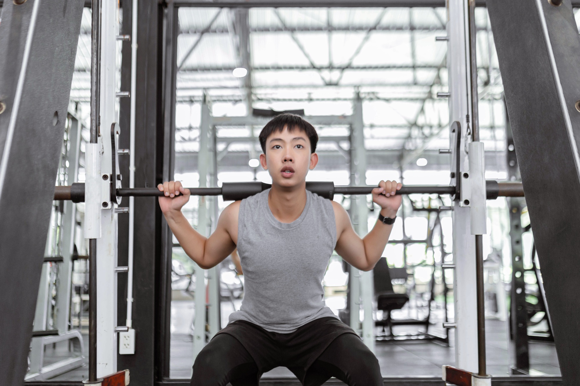 Asian men exercising in the gym