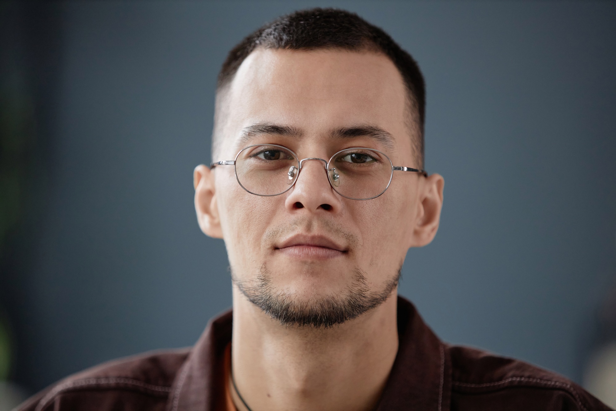 Close Up Asian Man Against Grey Wall
