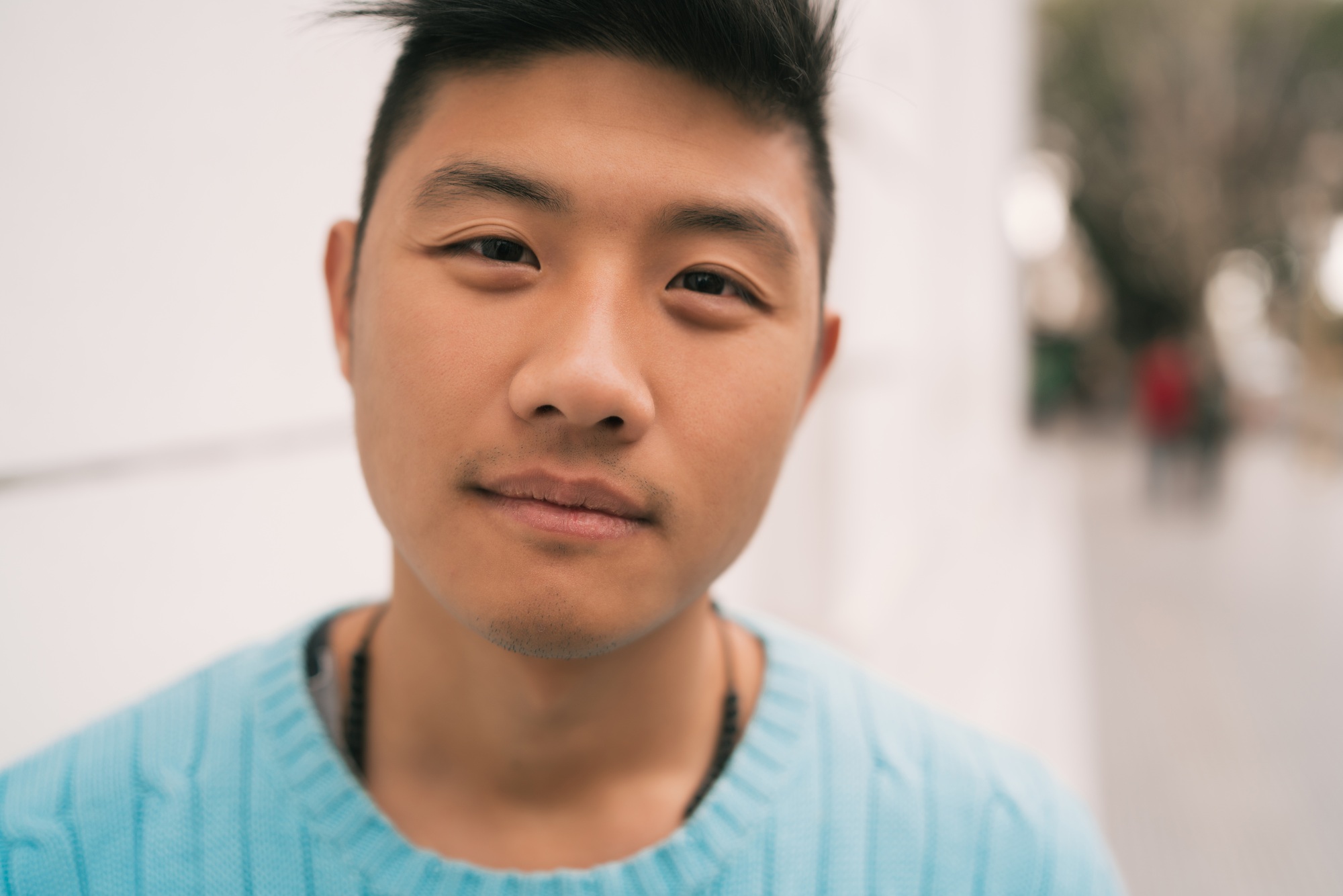 Close-up of young Asian man.